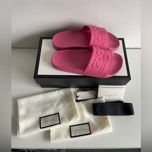 Pink Rubber Gucci Slides with St. Gucci print. Size 36, or usually a US 6.